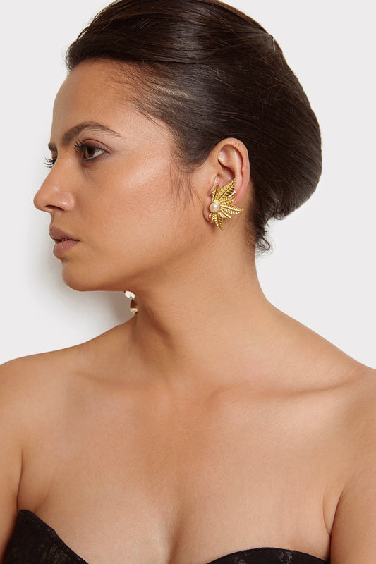 The modern girl's bold and beautiful golden pearl earrings.