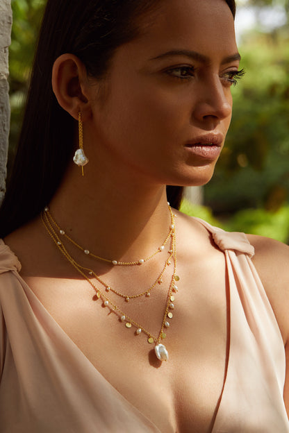 an elegant delight golden pearl necklace