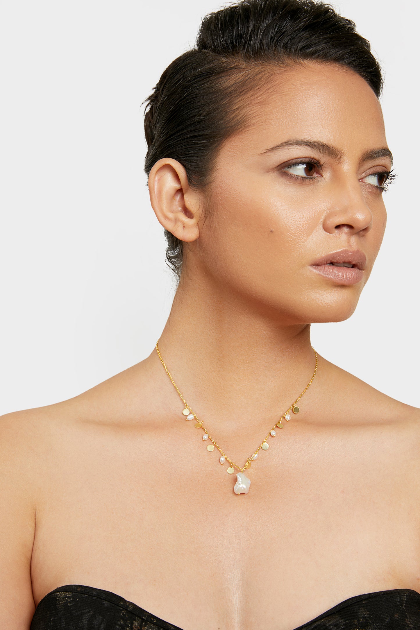 an elegant delight golden pearl necklace