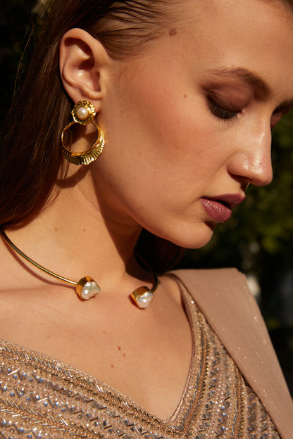 A glimmer of shimmer embelished golden earrings.