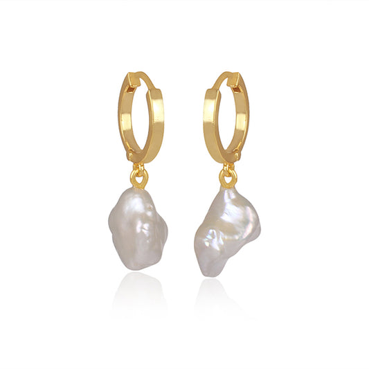 the subtle affirmation golden hoop pearl earrings