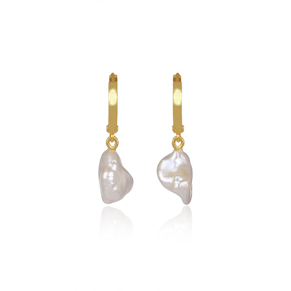 the subtle affirmation golden hoop pearl earrings