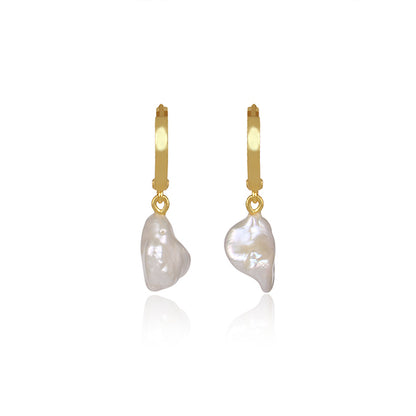 the subtle affirmation golden hoop pearl earrings