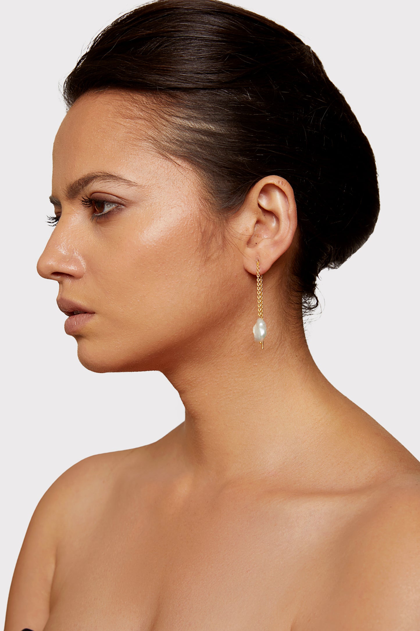 a divine allure golden pearl earrings.