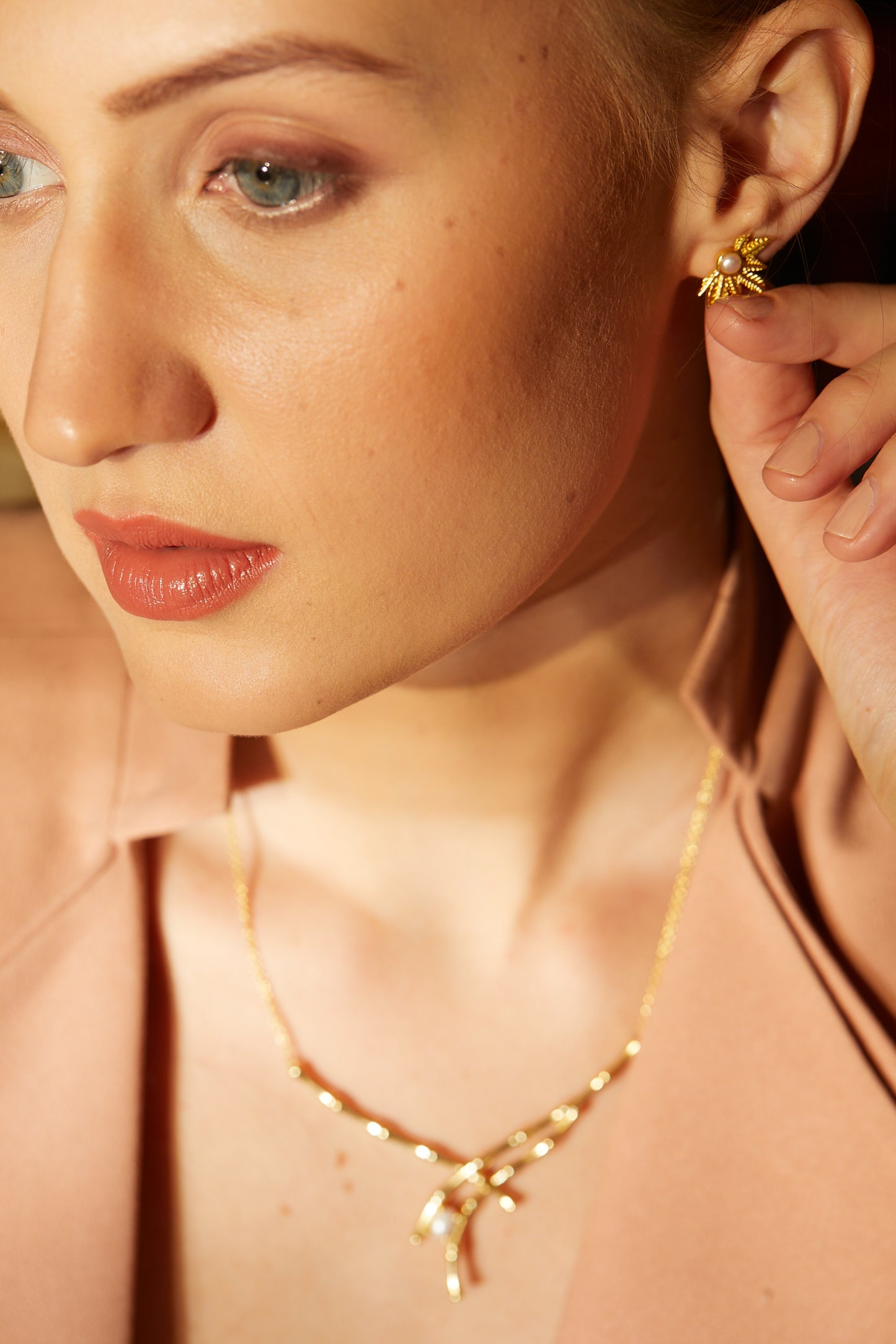 simplicity is endearing, precious golden pearl earrings.